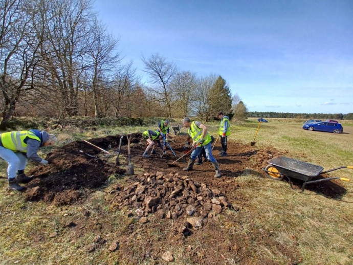 Friends of Dalby digging the drinking pool I